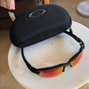 Oakley Sunglasses with Black Frame and Orange Lenses